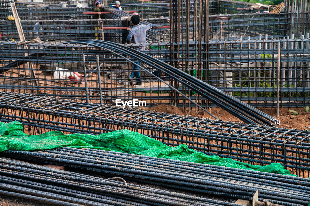 HIGH ANGLE VIEW OF WORKER WORKING ON FACTORY