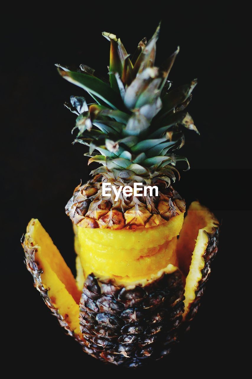 Close-up of pineapple against black background