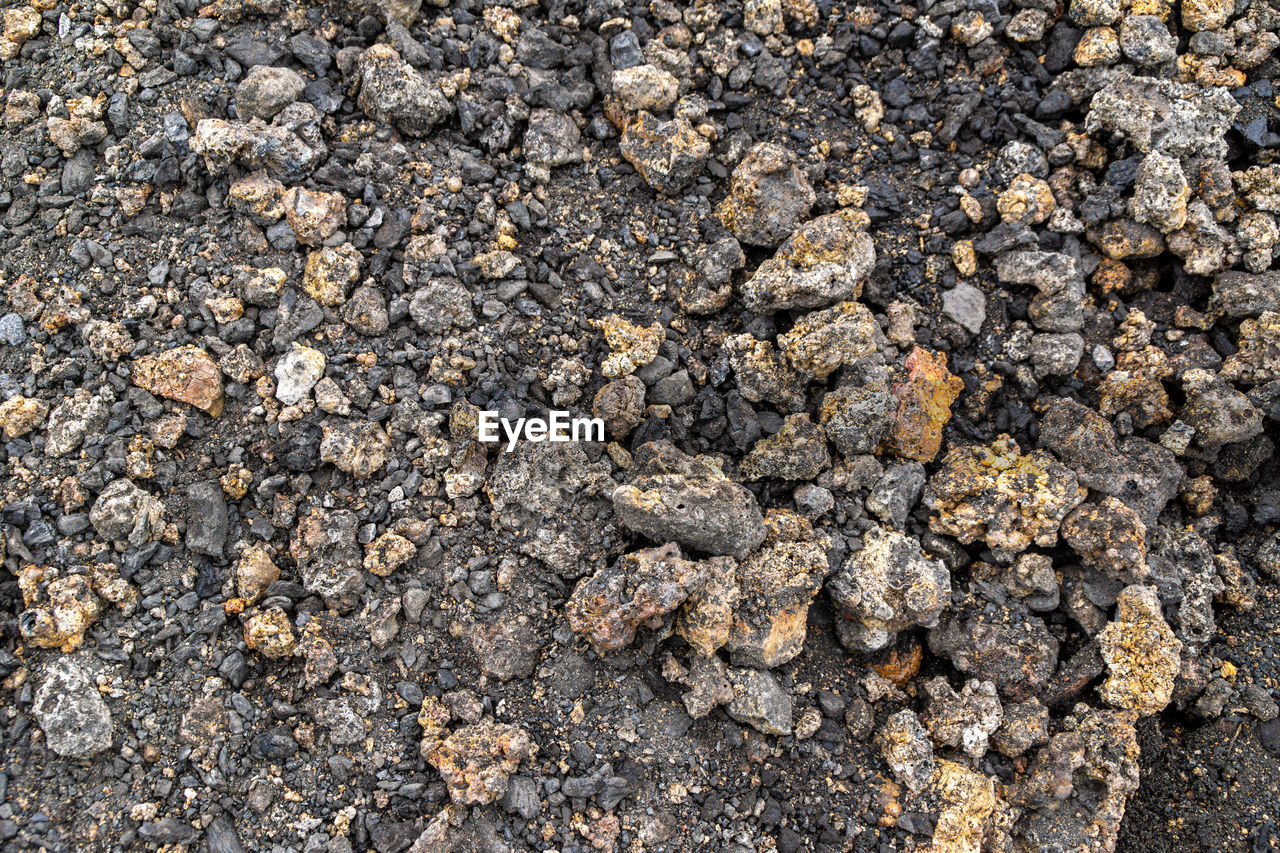 soil, asphalt, no people, nature, full frame, textured, day, backgrounds, rock, high angle view, land, outdoors, gravel, rough, sunlight, close-up, beach, directly above, geology, pattern, stone