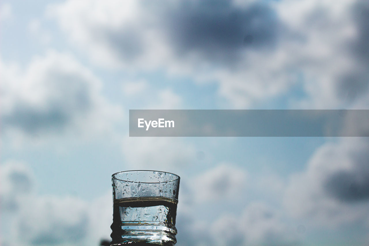 METALLIC STRUCTURE IN GLASS AGAINST SKY