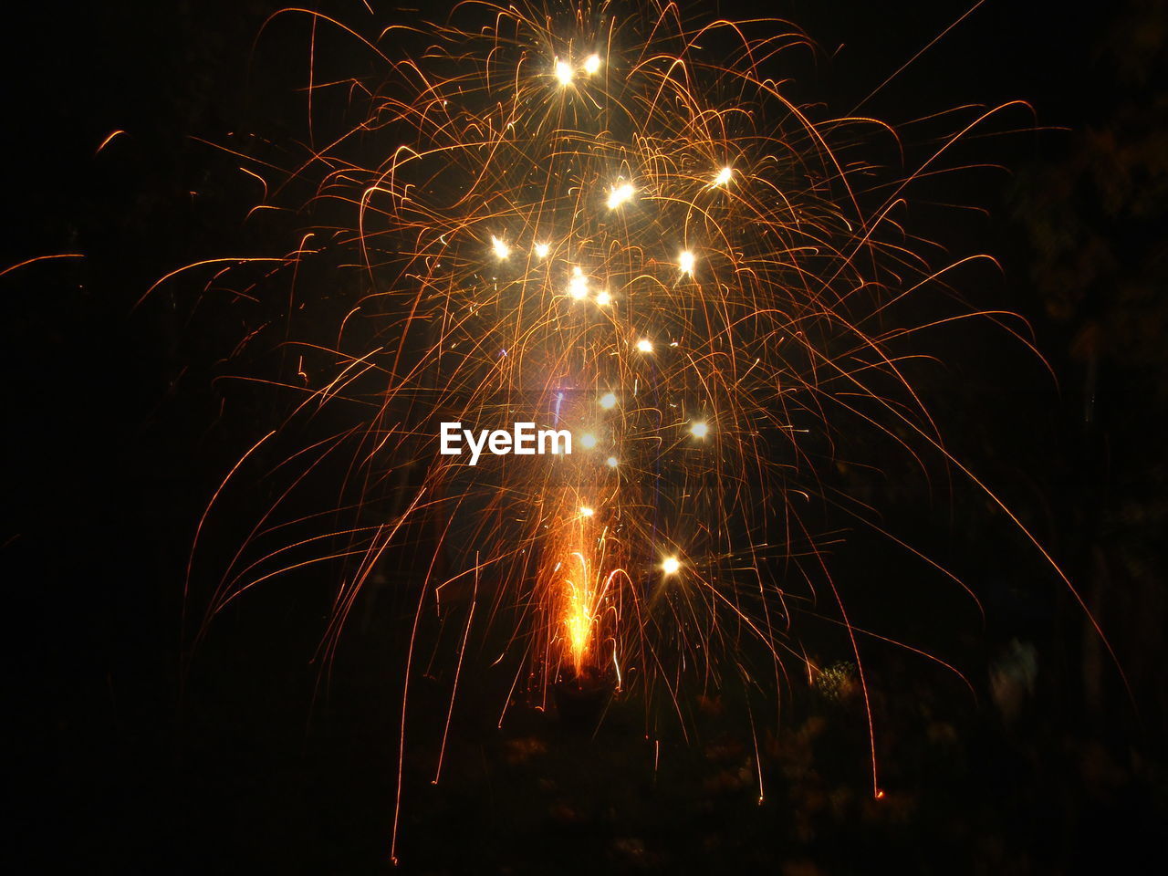 LOW ANGLE VIEW OF FIREWORK DISPLAY