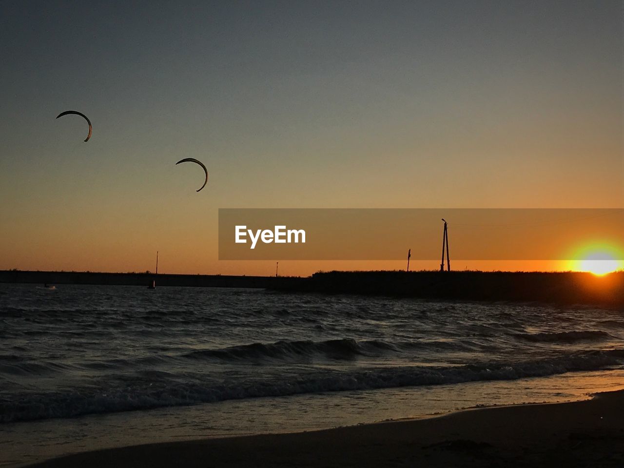 Silhouette of beach at sunset