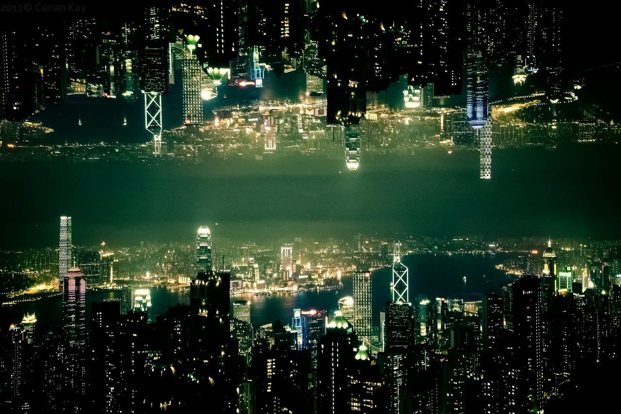 Aerial view of illuminated cityscape with reflection