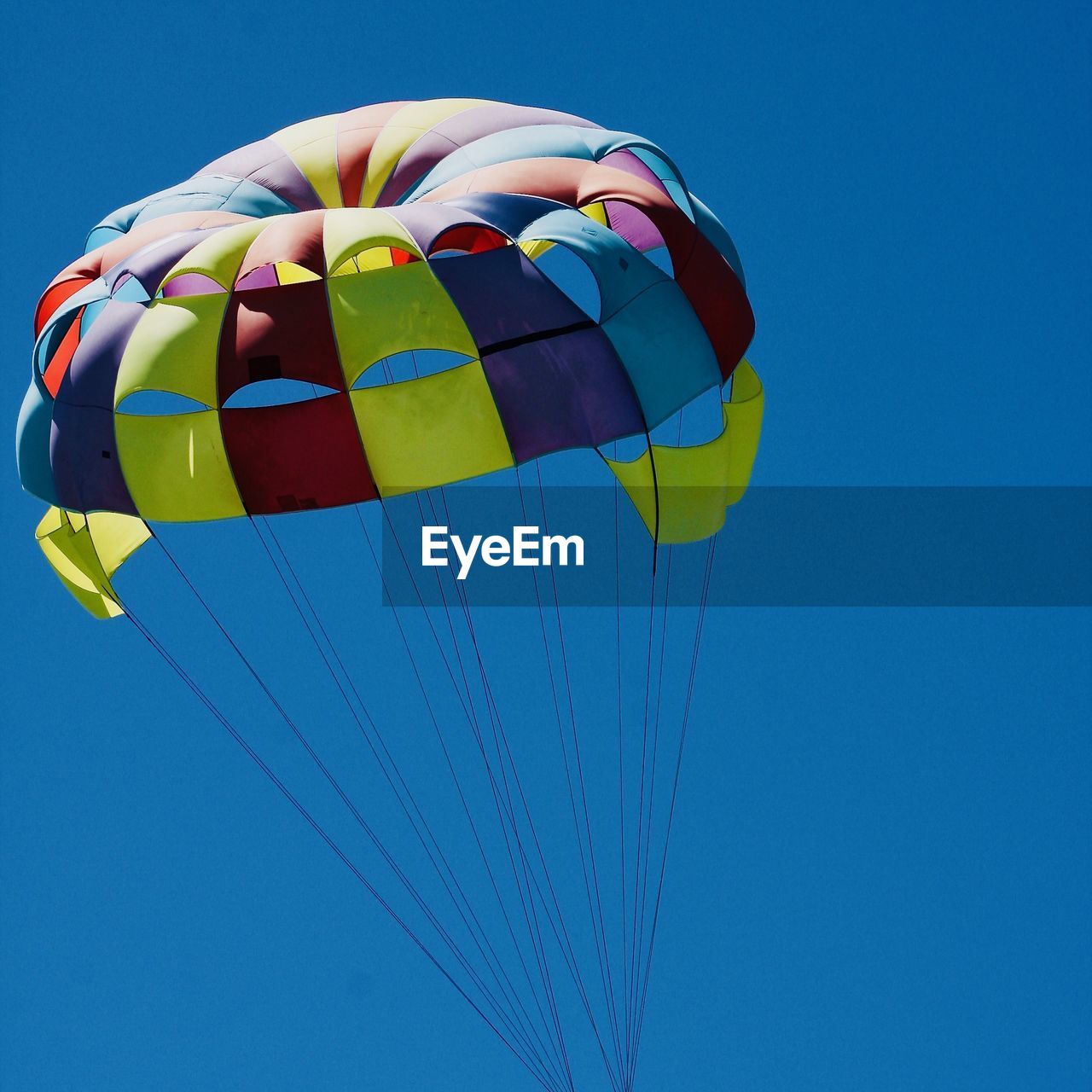 LOW ANGLE VIEW OF BALLOONS AGAINST BLUE SKY