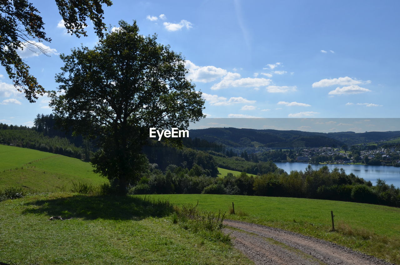 Scenic view of lake against cloudy sky