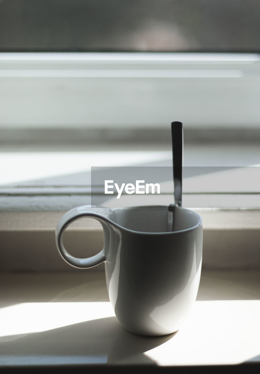 Close-up of coffee cup on table