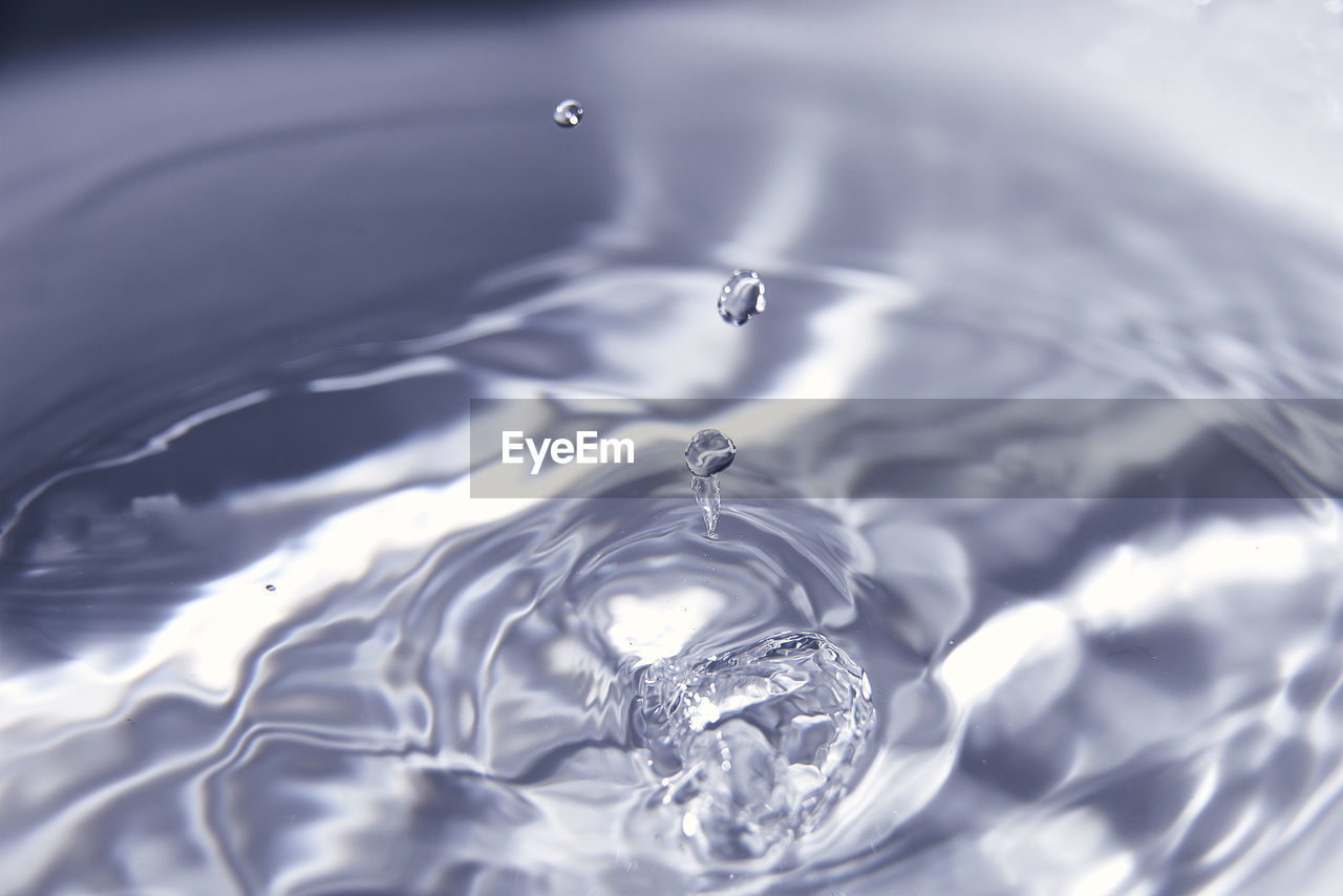 rippled, water, drop, motion, nature, splashing, close-up, no people, falling, concentric, freshness, purity, backgrounds, macro photography, petal, full frame, reflection, splashing droplet, outdoors, impact, blue, freezing, simplicity, selective focus