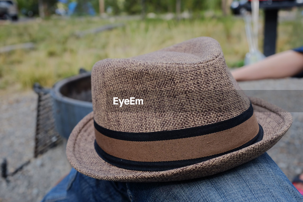 Close-up of person wearing hat