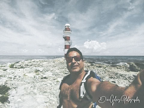 sea, water, sky, cloud, beach, nature, one person, land, adult, leisure activity, portrait, men, horizon over water, young adult, ocean, holiday, vacation, horizon, trip, day, smiling, lifestyles, coast, glasses, outdoors, happiness, beauty in nature, front view, fashion, looking at camera, sunglasses, emotion, sports, travel, relaxation, sunlight, waist up, copy space, scenics - nature, communication