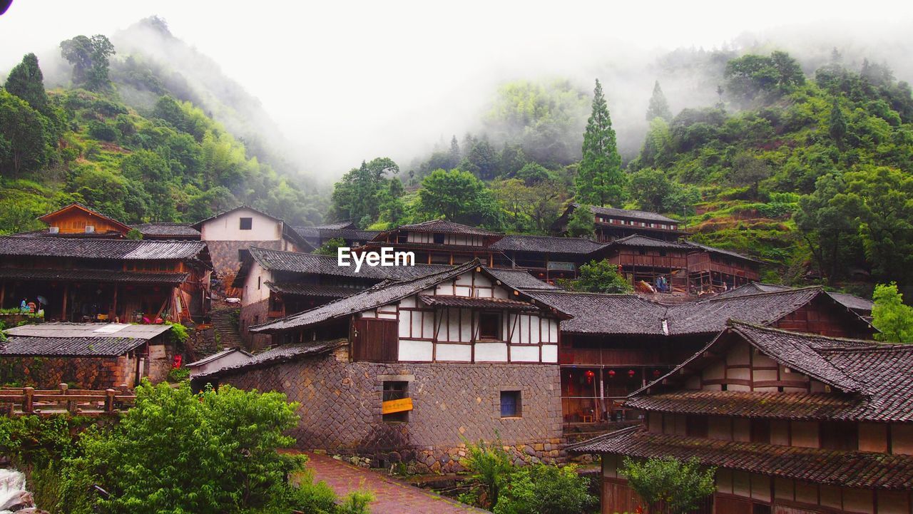 High angle view of town against cloudy sky