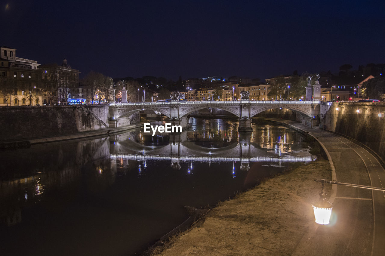 Bridge over river at night