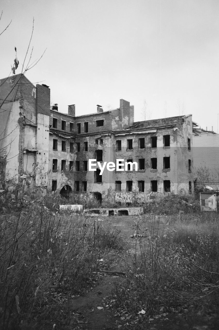 ABANDONED BUILDINGS AGAINST SKY