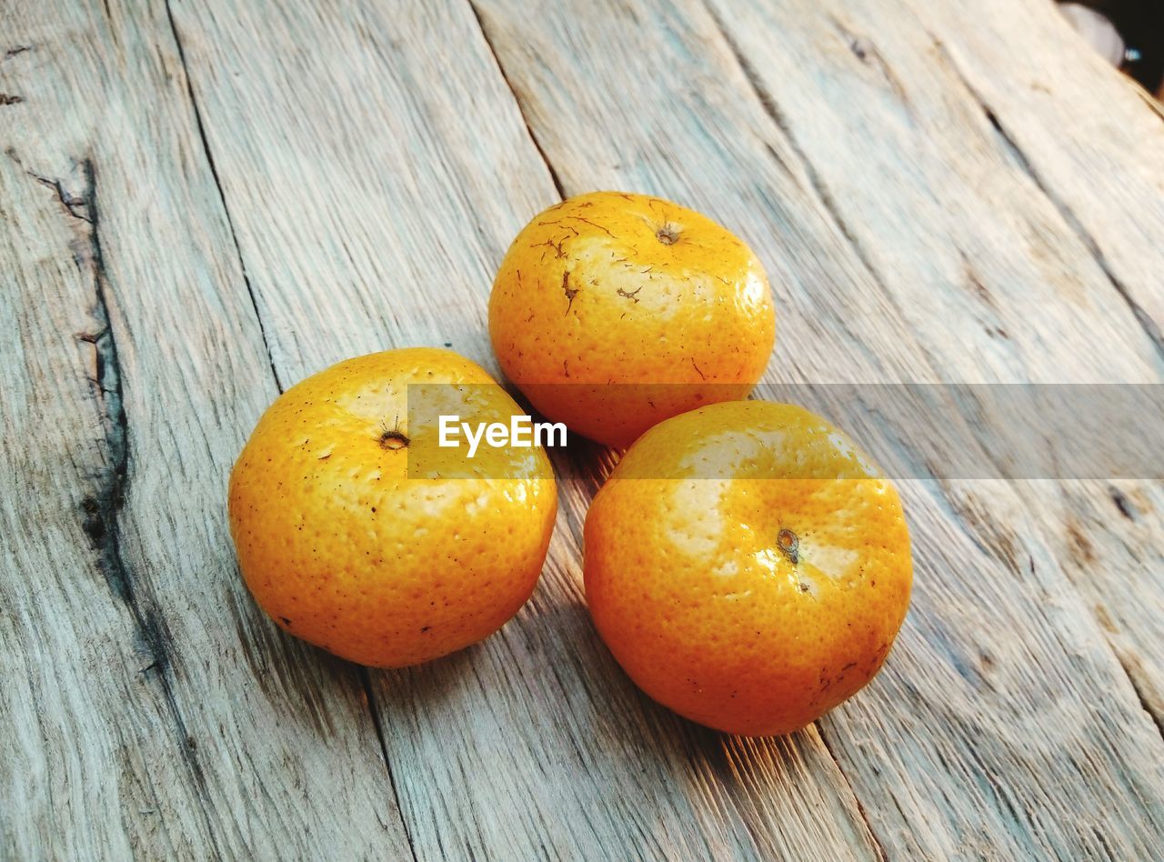 Close-up of oranges on table