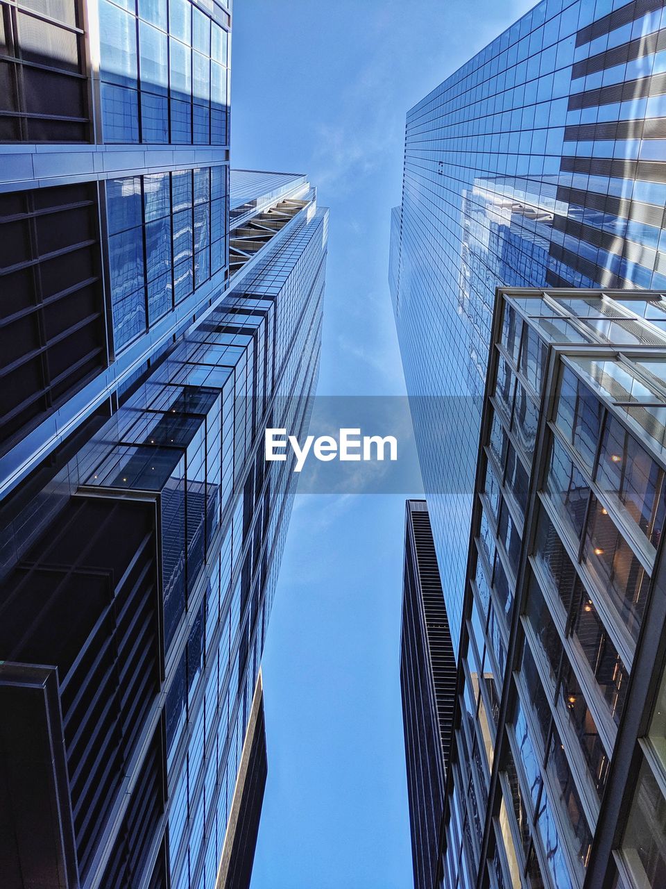 Low angle view of modern buildings against sky