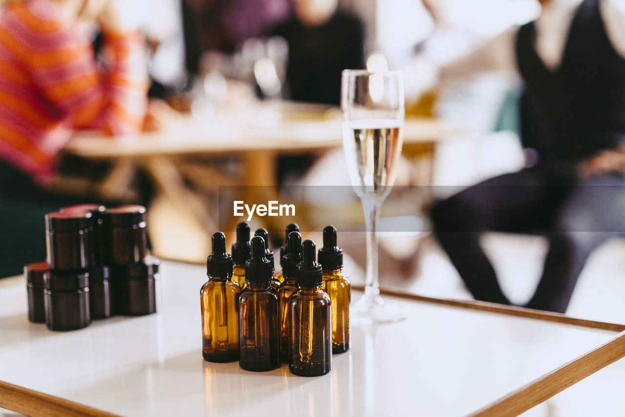 Bottles of essential oils samples arranged on table during event at convention center