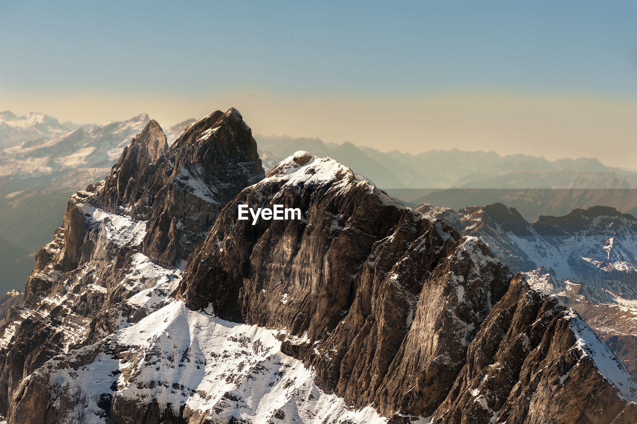 Scenic view of mountains against sky during winter