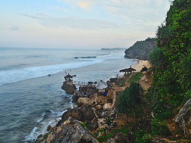 SCENIC VIEW OF SEA WITH ROCKS IN BACKGROUND