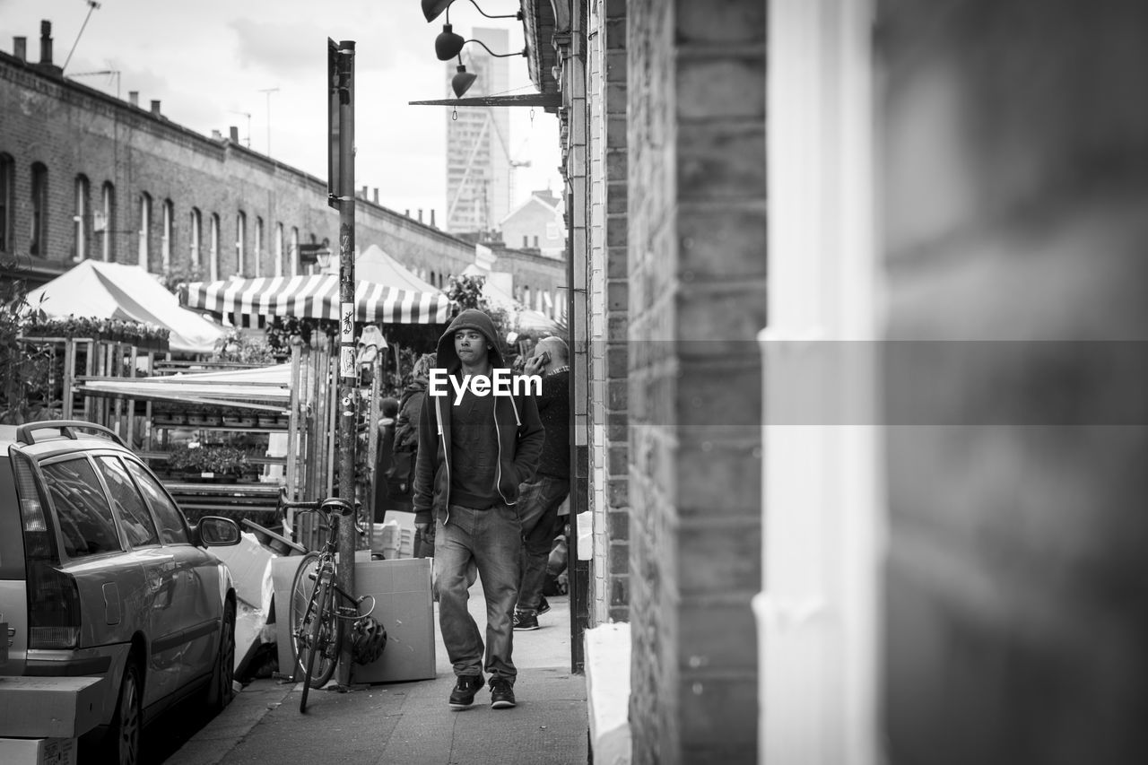 MAN ON STREET AGAINST CITY