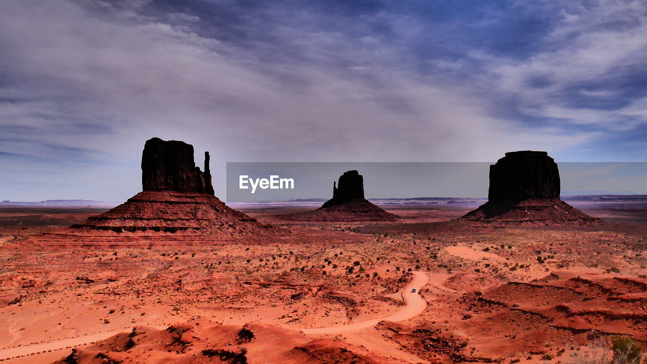 Scenic view of rock formations against sky