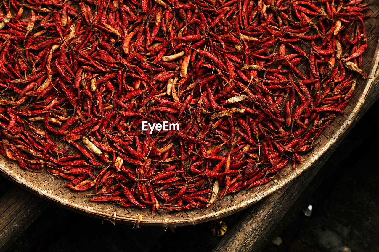 High angle view of dry red chili peppers in wicker