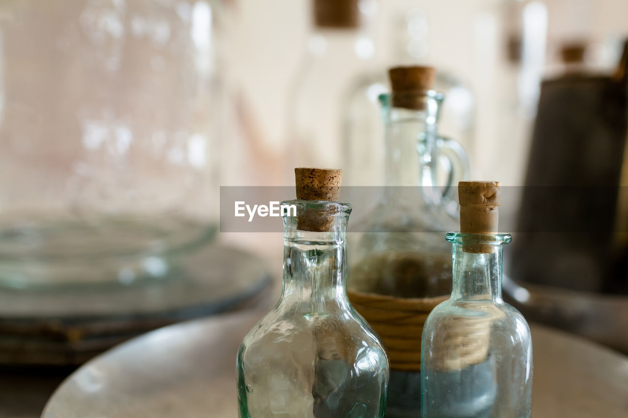 Close-up of wine bottles on table