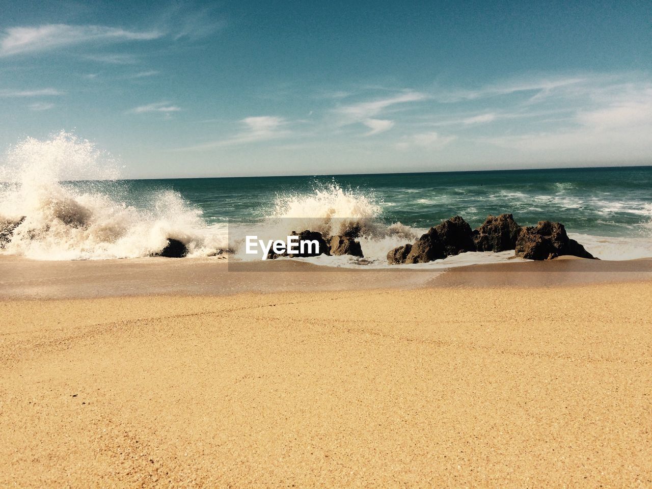 Waves rushing on rocks at seashore