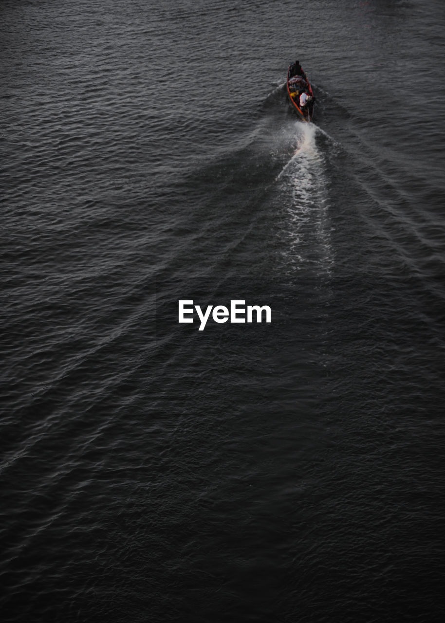 HIGH ANGLE VIEW OF PERSON ON SEA AGAINST SKY