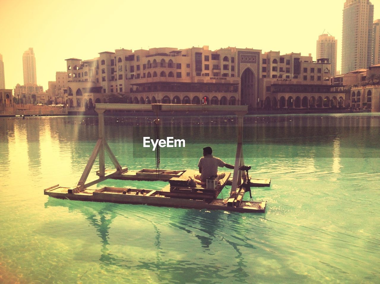 PEOPLE ON BOAT IN RIVER