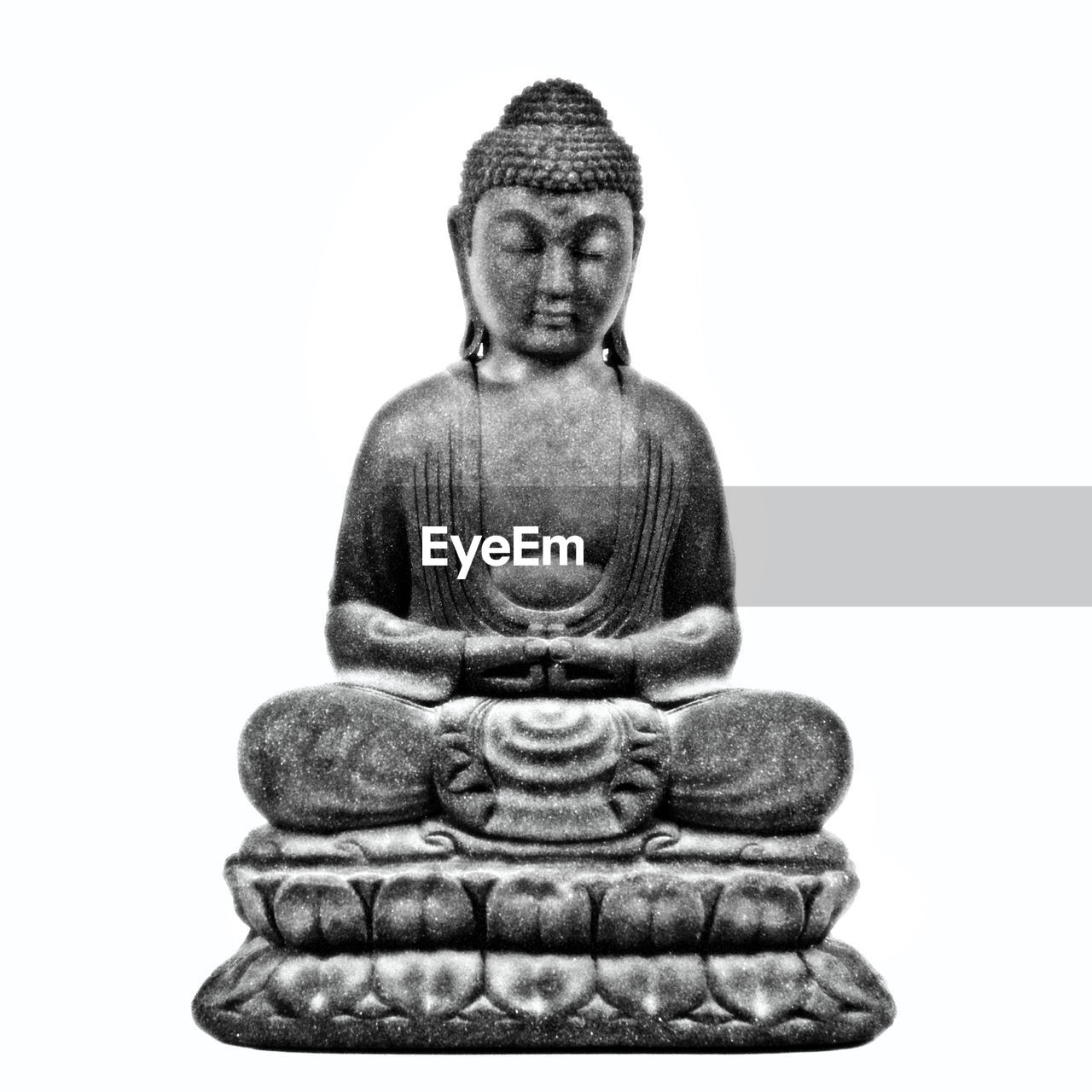 Close-up of buddha statue against white background