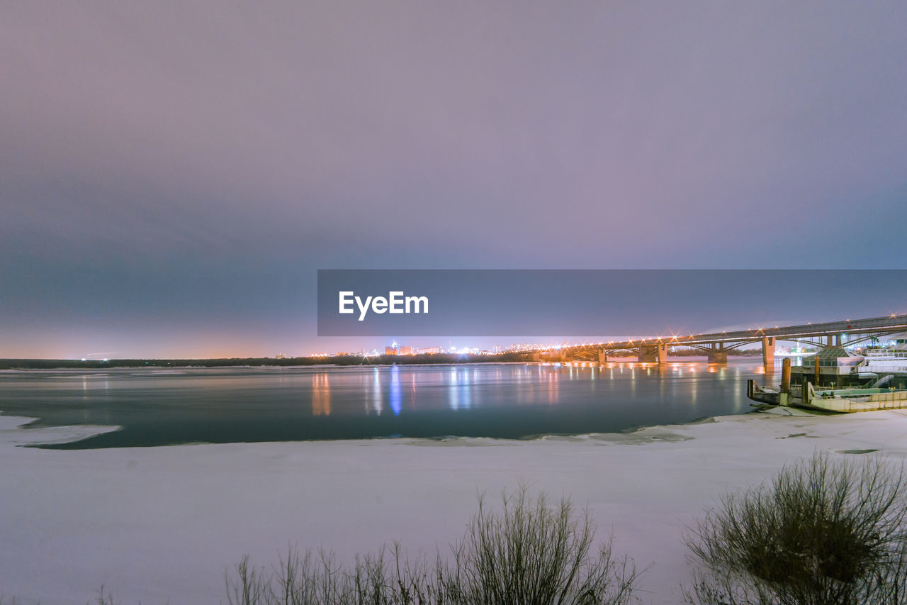 Bridge over river at night