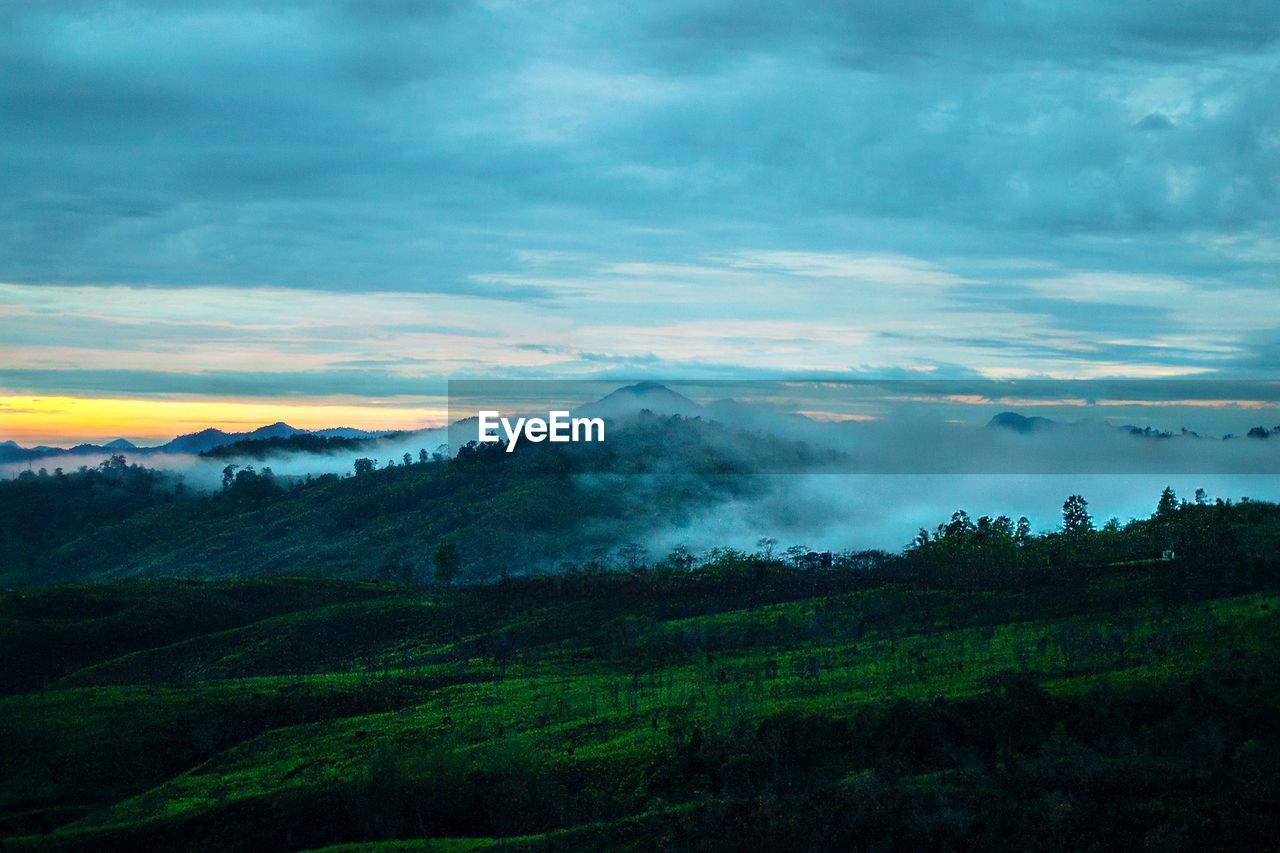 Scenic view of landscape against sky during sunset