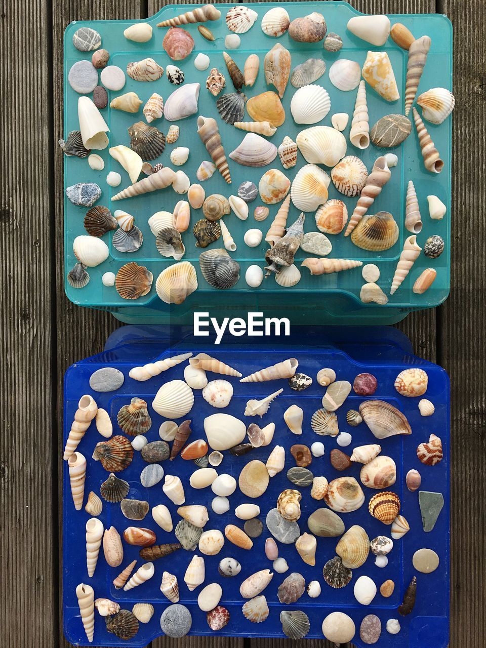HIGH ANGLE VIEW OF PEBBLES IN CONTAINER