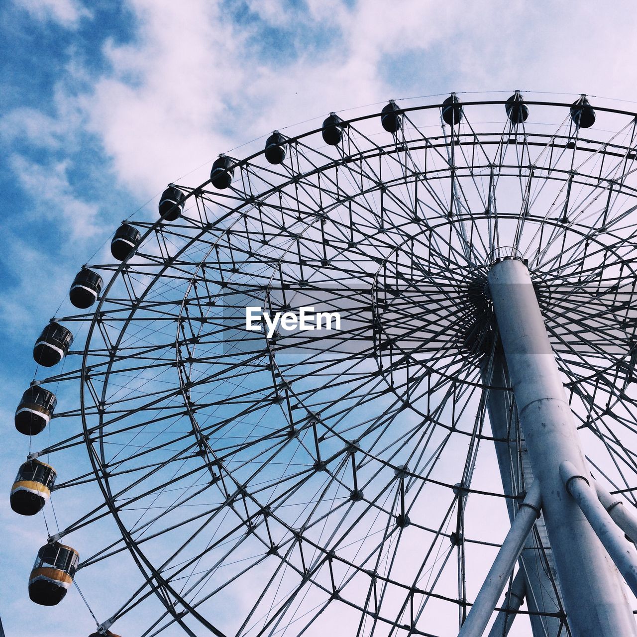 Low angle view of ferris wheel against sky