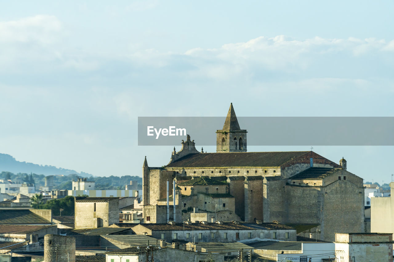 Buildings in city against sky