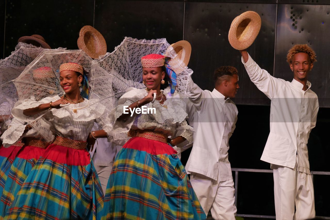 GROUP OF PEOPLE IN TRADITIONAL MASK