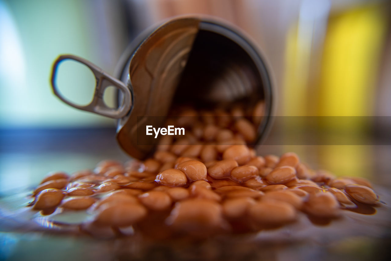 CLOSE-UP OF COFFEE BEANS IN JAR