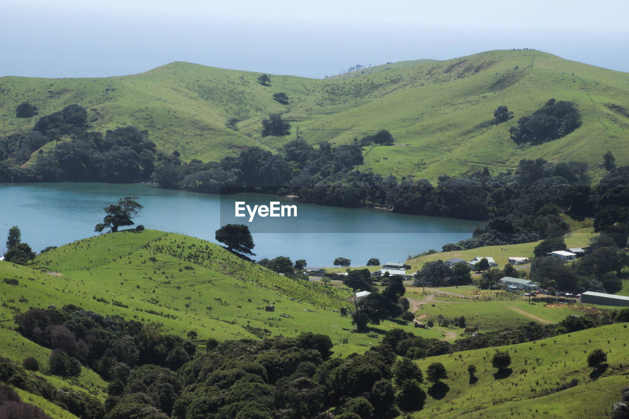 SCENIC VIEW OF GREEN LANDSCAPE AGAINST SKY