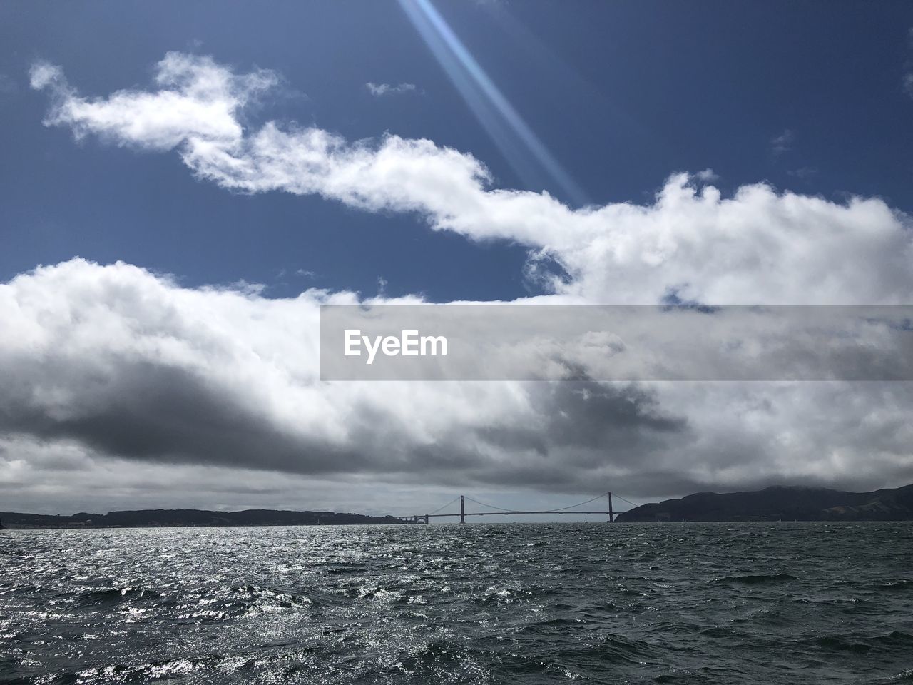 SAILBOAT IN SEA AGAINST SKY