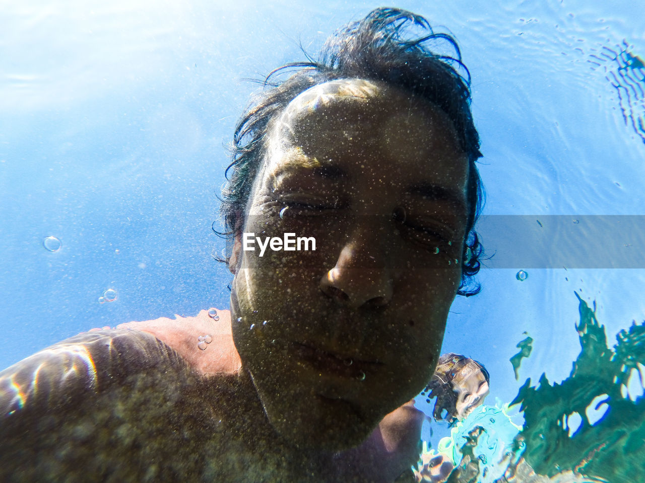 Close-up of man swimming in sea