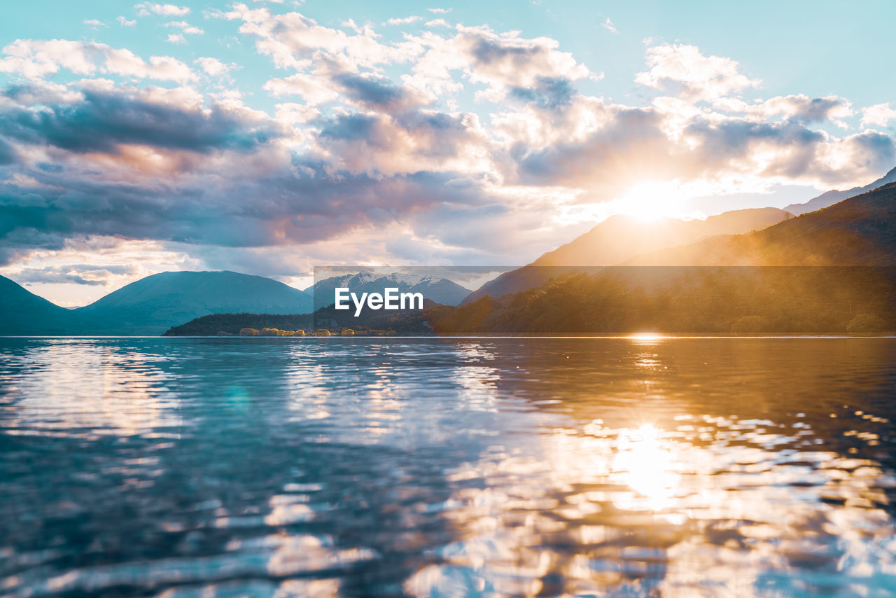 Scenic view of lake against sky during sunset