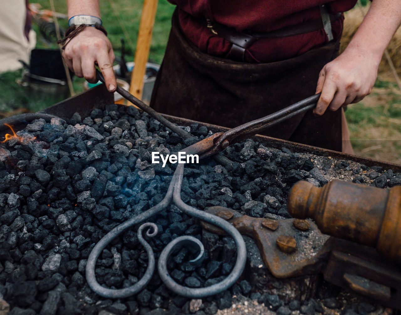 High angle view of man working on metal