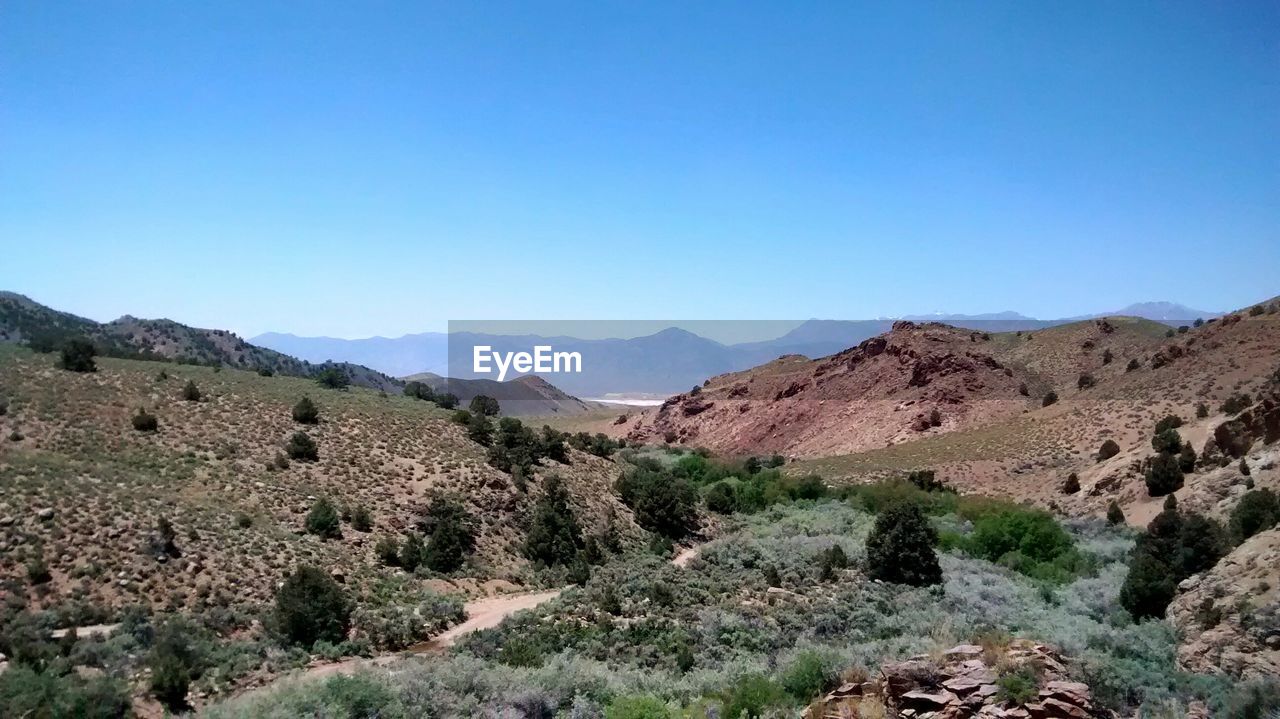 Scenic view of mountains against clear sky