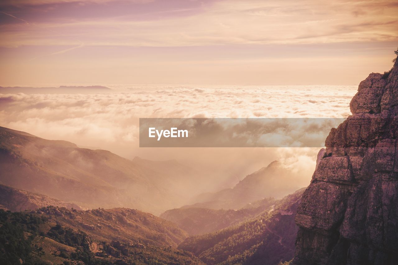 Scenic view of mountains against sky during sunset