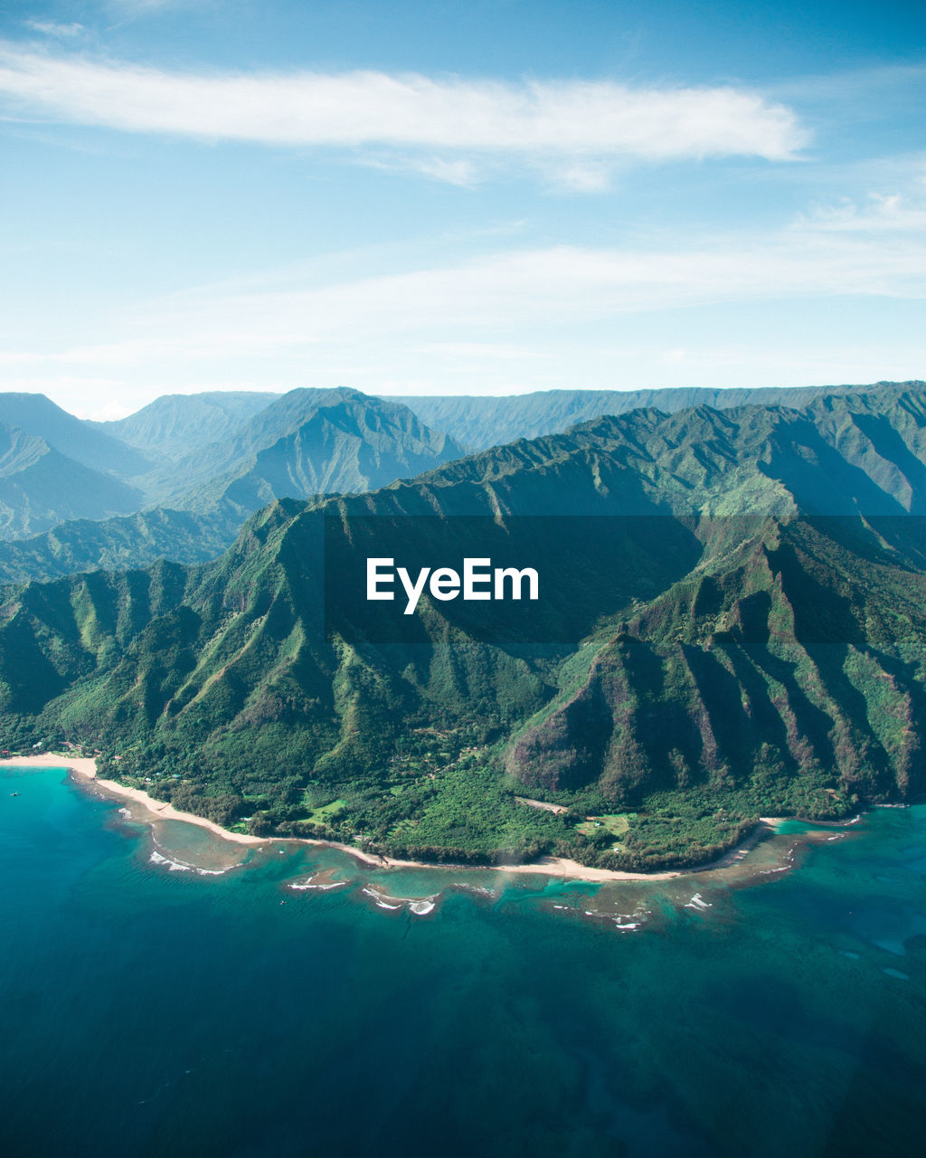 Scenic view of rock mountains by sea