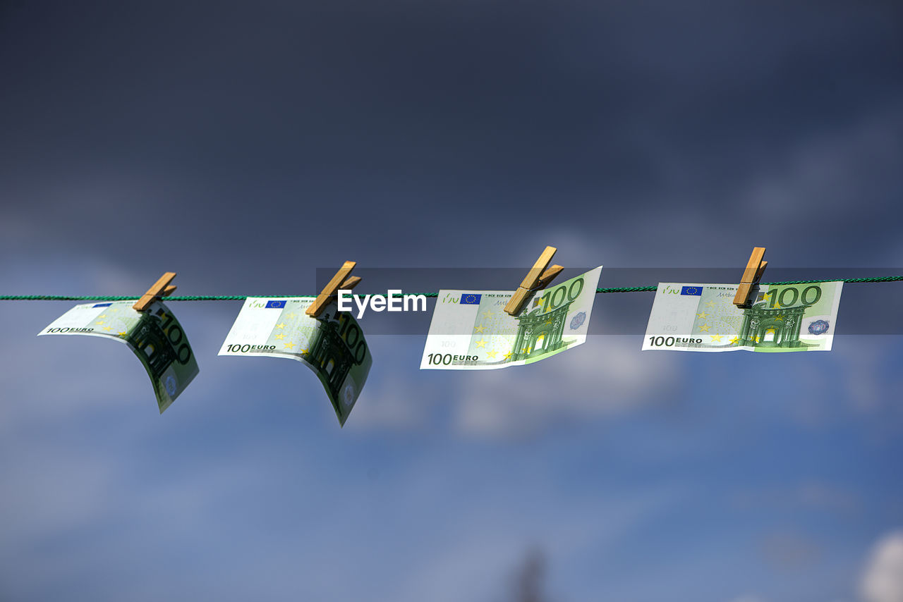 100 euro banknotes on a clothesline. money laundering theme.