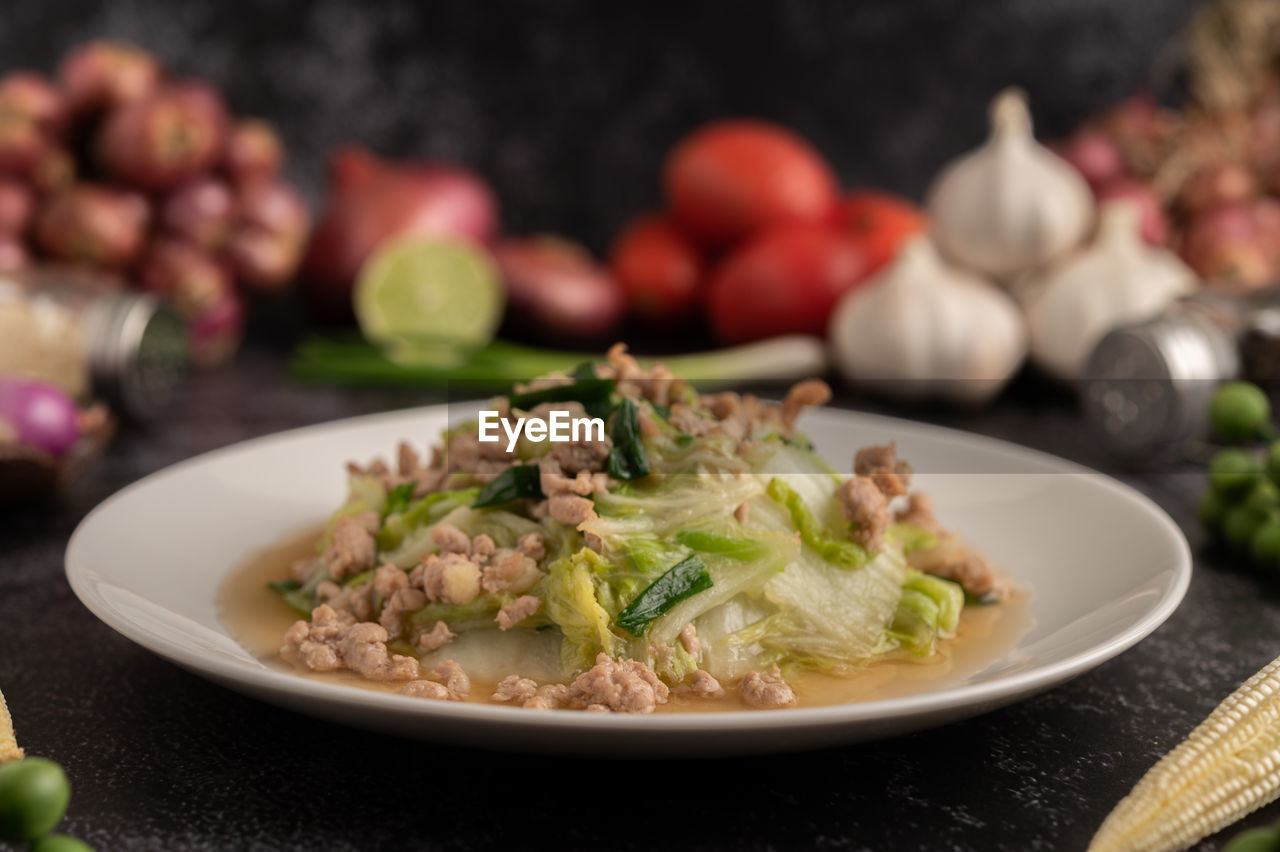 CLOSE-UP OF SALAD SERVED IN PLATE