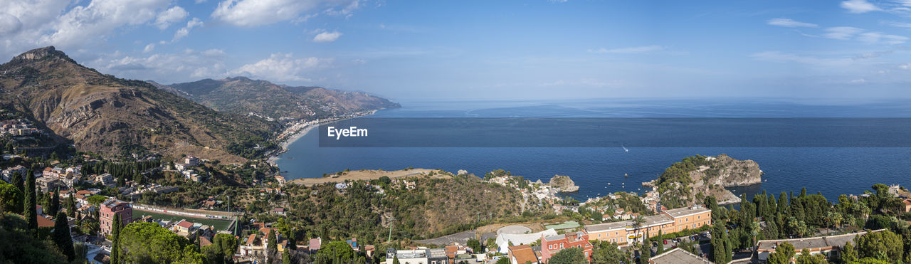 Aerial wide angle view of taormina and its beautiful coastline