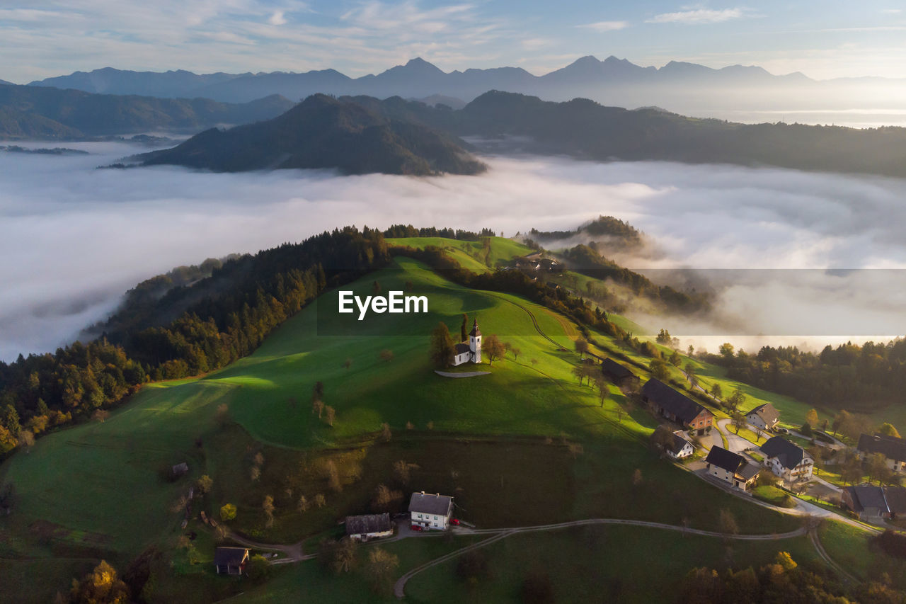 Scenic view of landscape and mountains against sky