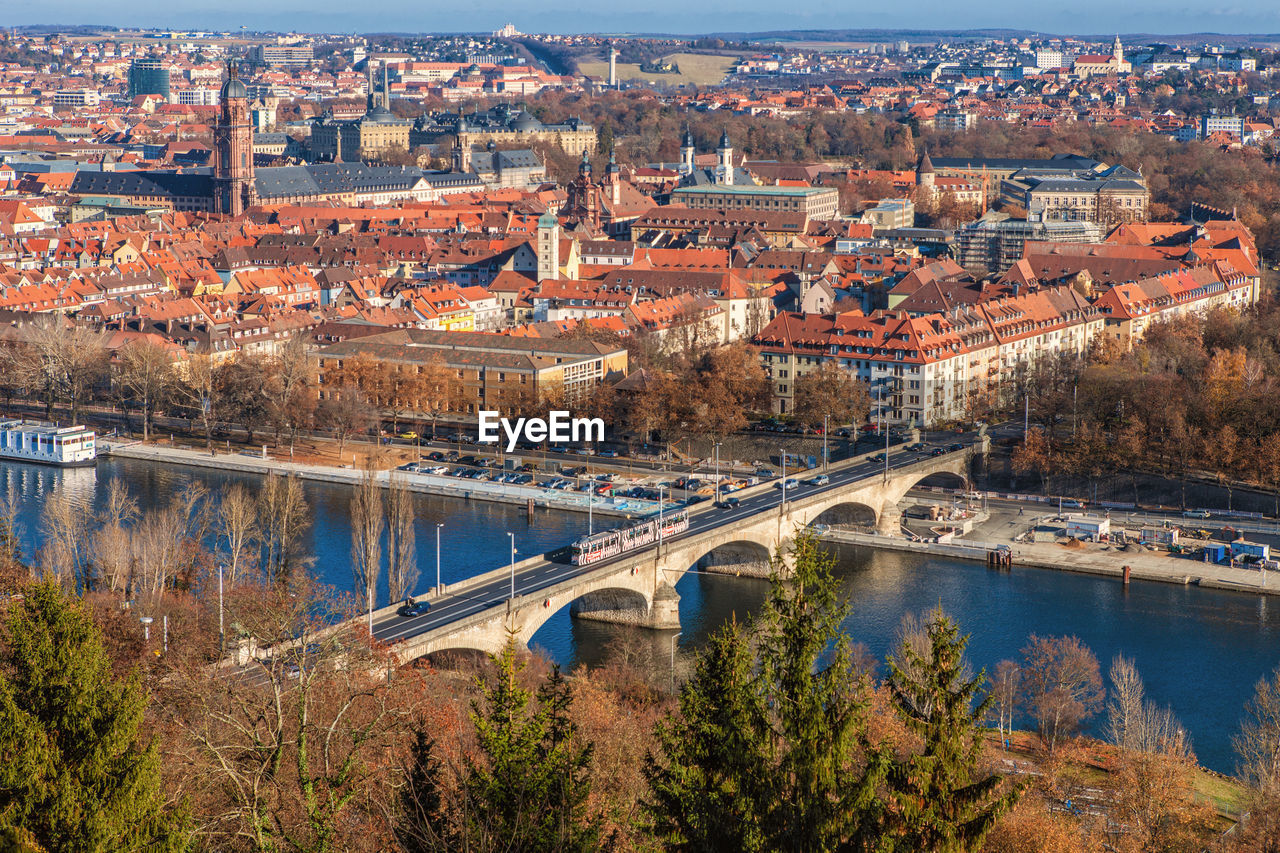 High angle view of bridge over river and buildings in city