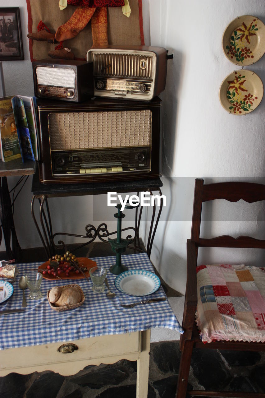 STACK OF OBJECTS ON SHELF